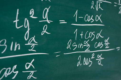 School, education, lesson. Mathematics formulas written on the chalboard