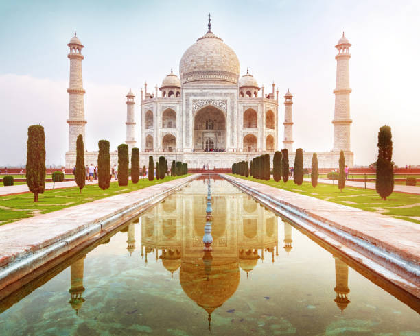 istock Sun rise at Taj Mahal front view reflected on the reflection pool. 1054632000
