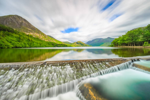 Long exposure of Crummock Water Weir in The Lake District, Cumbria, England