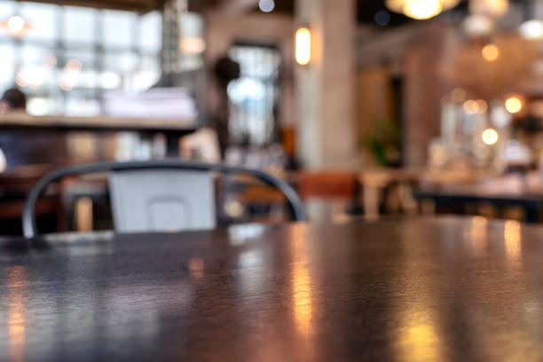 istock Vintage wooden table and chairs in loft cafe 1054635610