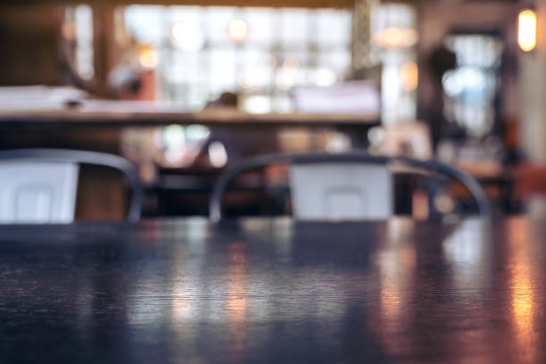 istock Vintage wooden table and chairs in loft cafe 1054635618