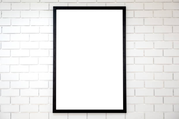 istock A blank black wooden picture frame on white brick wall background 1054637032
