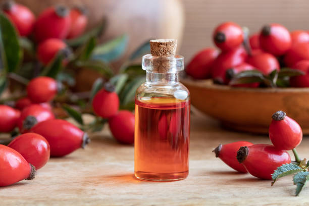 istock A bottle of rose hip seed oil with fresh rose hips 1054637112