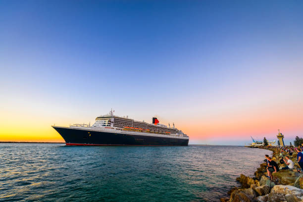 Adelaide, Australia - February 16, 2018:  Queen Mary 2 cruise ship leaving Outer Harbour passenger terminal