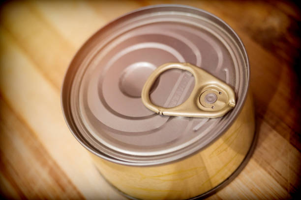 istock Tin on a wooden board in a kitchen 1054655142