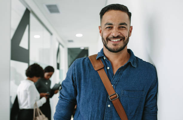 istock Man in casuals standing at office hallway 1054657146