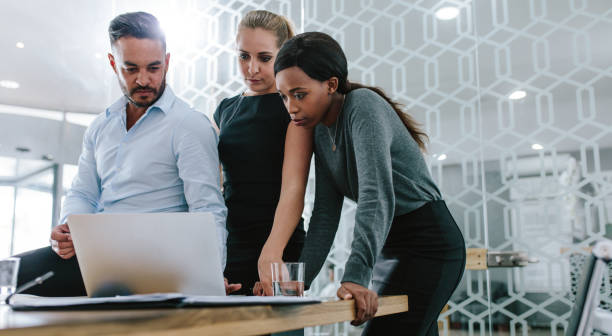 istock Business team working together on their project 1054657396