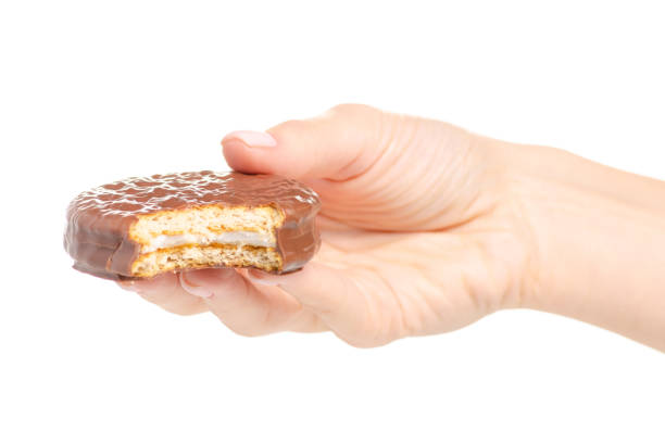 istock Chocolate sandwich cookie in hand 1054662692