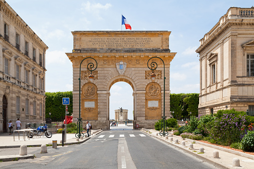 Montpellier, France - June 09 2018: The Porte du Peyrou is a triumphal arch situated at the eastern end of the Jardin de Peyrou, a park near the center of the city.
