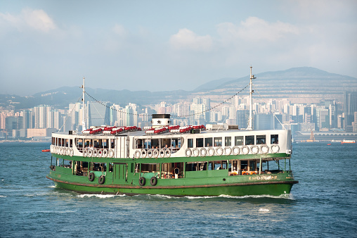 VICTORIA HARBOUR, HONG KONG - SEPT 9, 2013 - Hong Kong's Star Ferry crossing Victoria Harbour.