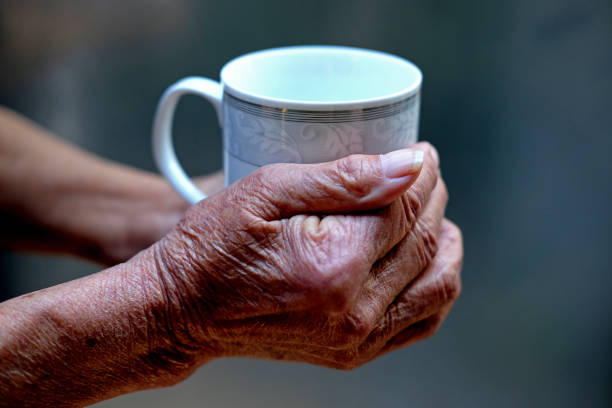istock A pair of old hands hold a Chinese tea cup 1054670666