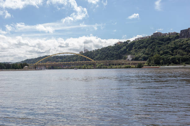 istock Yellow bridge crossing calm river 1054676444