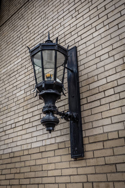 istock Vintage street lamp on brick wall 1054676500