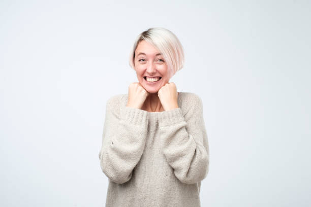 istock Young caucasian woman smiling standing on gray background 1054676828