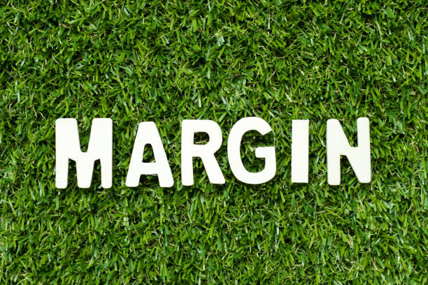 istock Alphabet letter in word margin on artificial green grass background 1054689466
