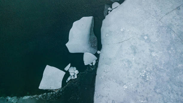 istock frozen lake half water half ice, ice floe, drone shot with the dji magic pro 1054696154
