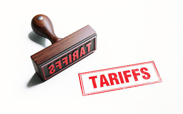 istock Wooden Tariffs Stamp On White Background 1054696188