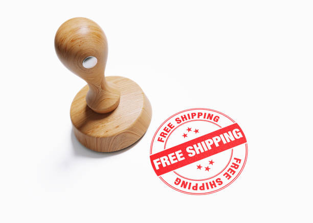 istock Wooden Free Shipping Stamp On White Background 1054696512