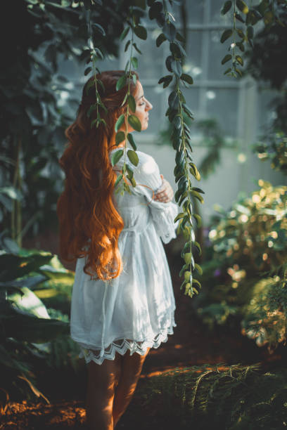 istock Dreamy woman in tropical environment 1054696772