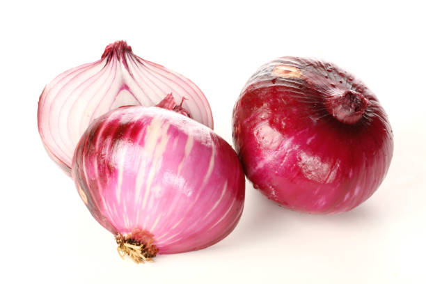 istock Red onion slice  isolated on white background 1054702604