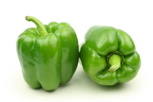 istock Green bell peppers  on white background 1054702838