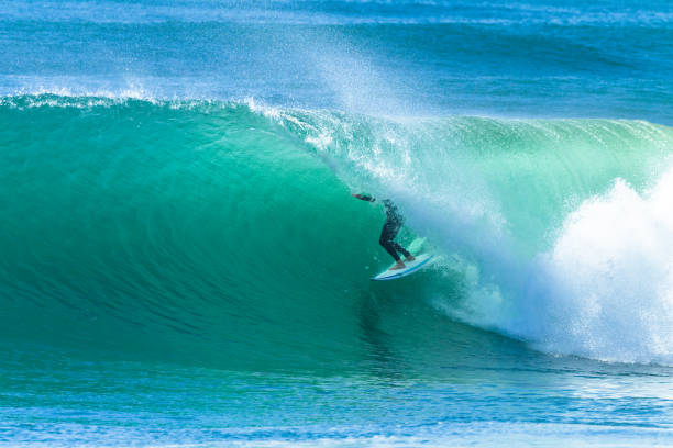 istock Surfer Surfing Tube Ride 1054703062
