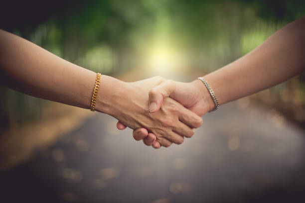 istock closeup women's handshaking 1054713592
