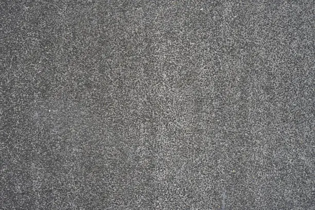 Photo of Texture of a gray wall in a small stone