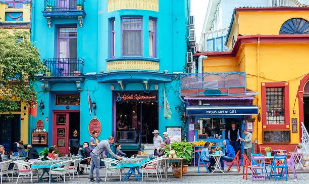 Istanbul, Turkey-October 5, 2018: Tourists are sitting outside cafes and restaurants in this colourful street in the Sultanahmet district.