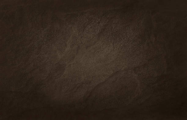 istock Dark brown slate texture in natural pattern with high resolution for background and design art work. Brown stone wall. 1054722578