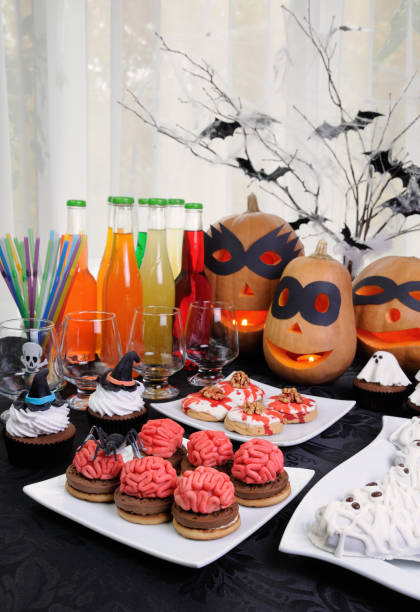 istock Table served with a variety of sweets and drinks on Halloween 1054722818