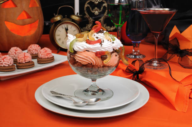 istock Chocolate balls covered with whipped cream with gelatin worms 1054724906
