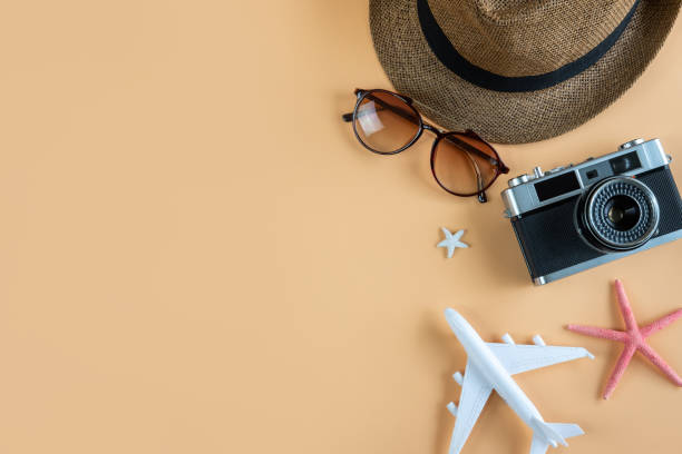 istock Traveler accessories items and camera on color background, Summer vacation concept 1054729148