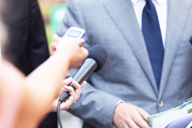 istock Journalist making media interview with unrecognizable business person 1054729586