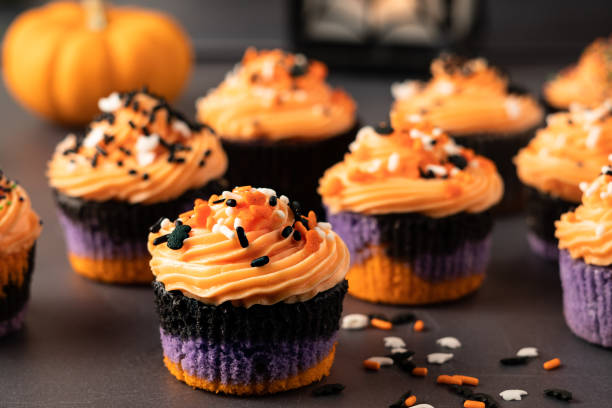 istock Halloween Cupcakes with Orange Frosting 1054731842