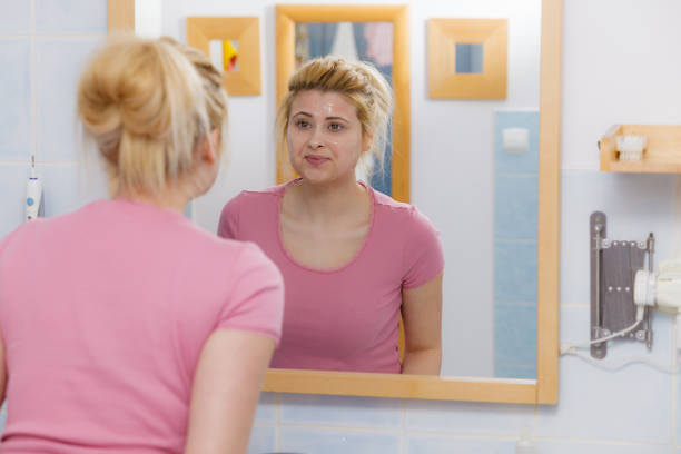 istock Young woman having gel mask on face 1054735948