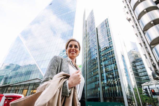 istock Successful businesswoman in financial district using phone 1054741972