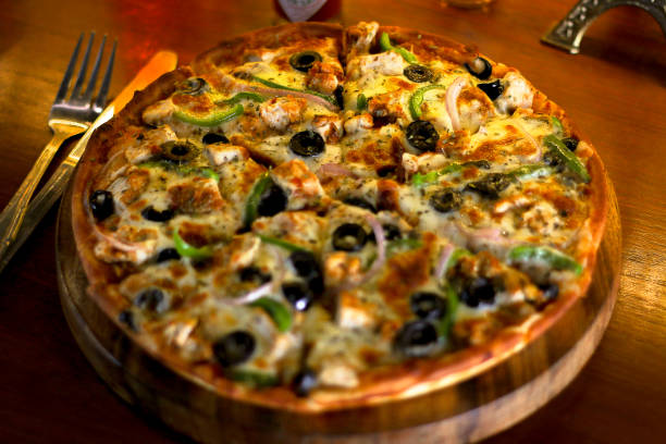istock Deliocuous BBQ Chicken Cheese Pizza with extra cheese and Black Olive 1054748792