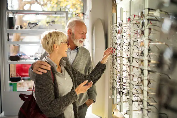 Photo of Senior couple shopping for eyeglasses