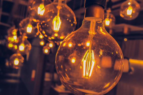istock vintage tungsten light bulb hanging loft style interior dim lighting decoration 1054750746