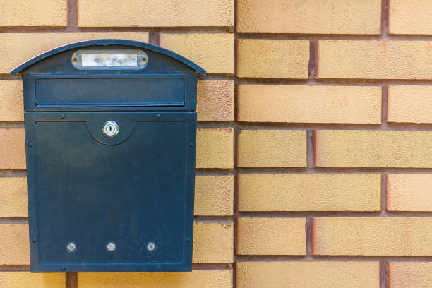 istock A beautiful mailbox hangs waiting for newspapers, parcels and letters. 1054758212