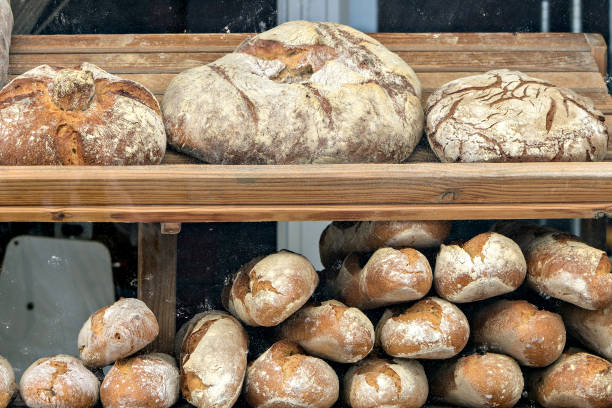 istock Artisan breads displayed in European bakery window. 1054760974