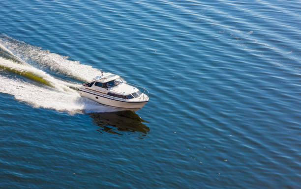 istock speed boat swims in the sea on a clear 1054761944