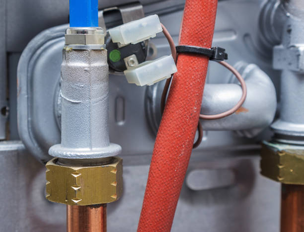 istock Copper pipes, heating boiler repair. Abstract industrial image. 1054768956