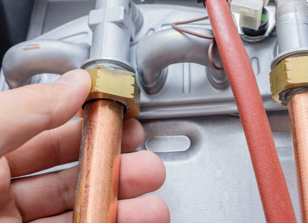 istock Copper pipes, heating boiler repair. 1054769348