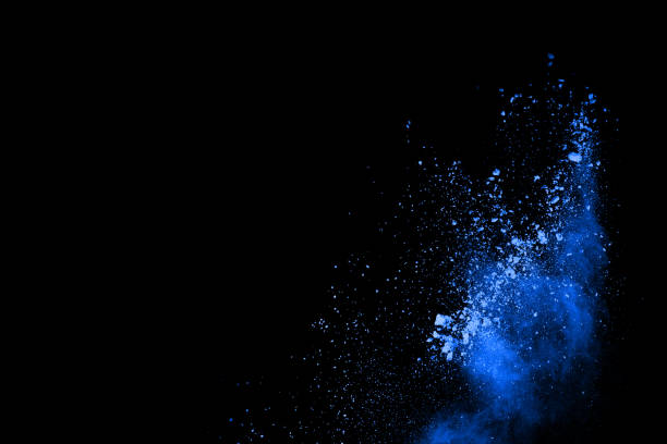 istock abstract blue powder splatted background,Freeze motion of color powder exploding/throwing color powder,color glitter texture on black background. 1054778274
