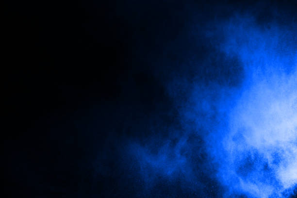 istock abstract blue powder splatted background,Freeze motion of color powder exploding/throwing color powder,color glitter texture on black background. 1054778418
