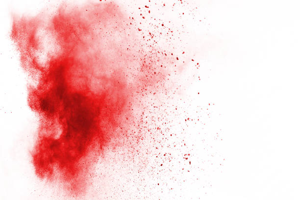 istock Freeze motion of red powder exploding, isolated on white background. Abstract design of red dust cloud. Particles explosion screen saver, wallpaper 1054778648