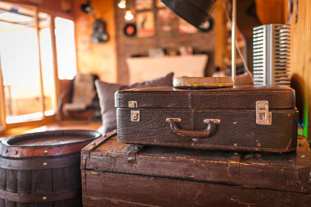 istock Vintage old classic travel leather suitcases as decoration in interior 1054782436