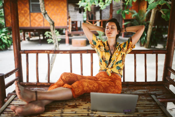 istock Young woman doing her freelance work outdoors in Thailand 1054785204